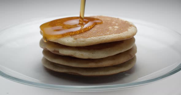 Pancakes and maple syrup macro slow motion 4K