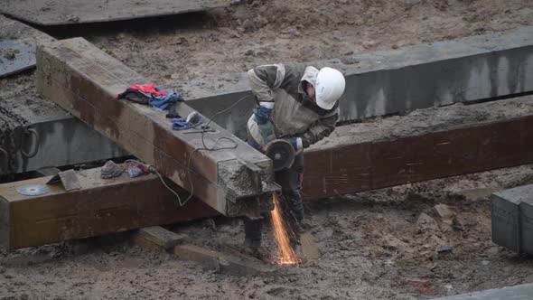Angular Saw Grinding Through Construction Piles at Construction Site alt