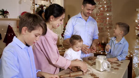 Family is Having Fun While Bakes a Cookies at Home Kitchen