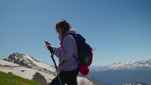 Woman Mountain Hiker Using Gps on Mobile Phone to Check the Route alt