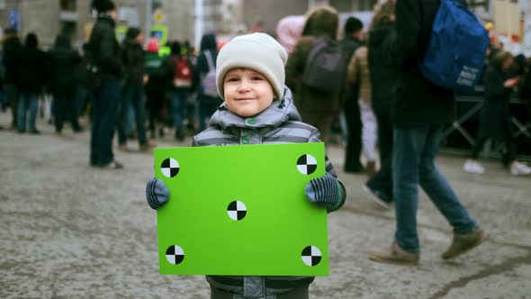 Portrait Face of Child with Chromakey Placard