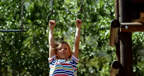Schoolboy playing in playground alt