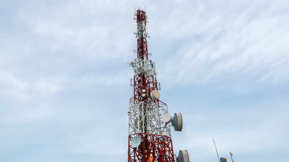 Time Lapse of Telecommunication Tower Against Sky and Clouds in Background alt