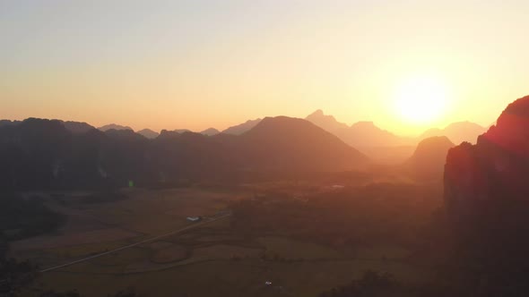Aerial: Vang Vieng backpacker travel destination in Laos, Asia. alt