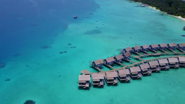 Aerial view seascape of exotic shore beach break by blue ocean with sand background alt