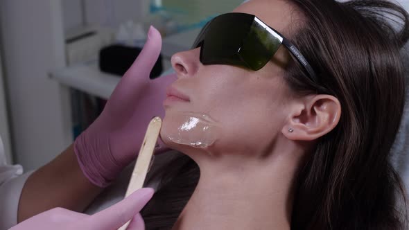 Applying the Master Contact Gel for Laser Hair Removal in a Beauty Salon