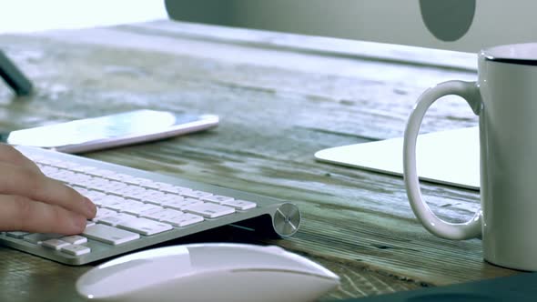 A Caucasian Male Typing on a Wireless Keyboard 05 alt