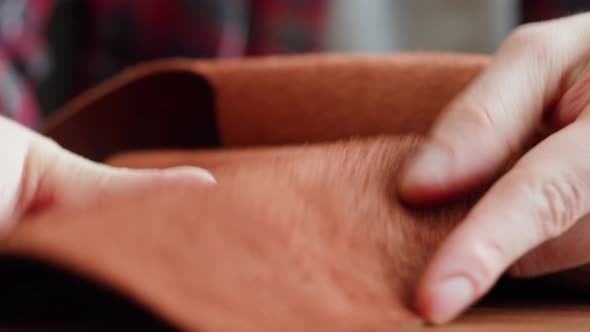Craftsman Touching Leather Closeup Production of Handmade Accessories Made of Genuine or Artificial alt