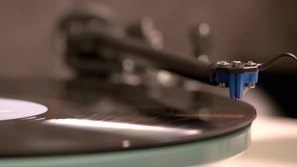 Close Up Hand Turning on Vintage Record Player alt