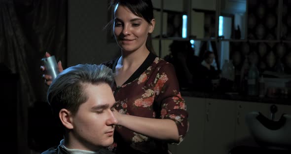Skilled Hairdresser Fixes Fashionable Hairstyle on Guy Head