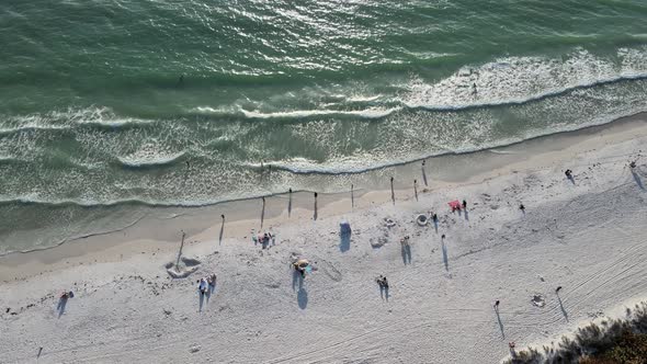waves, sun and fun during sundown on Cortez Beach in Bradenton, Florida in the aerial drone view alt