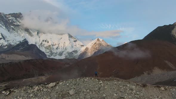 Lhotse South Face Mountain and Hiker Man at Sunset. Himalaya, Nepal. Aerial View alt