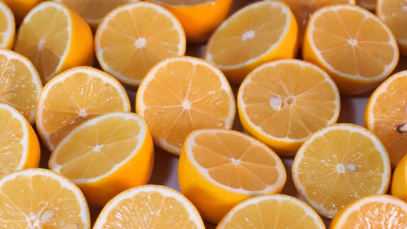 Closeup cut fresh lemons filmed with a movement on the slider alt