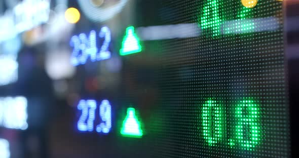 Stock market display screen in the city at night alt