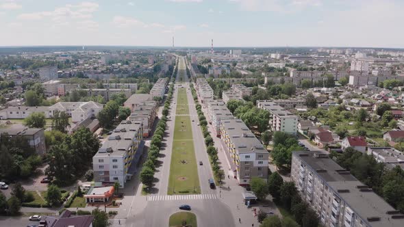 Central Wide Avenue Road with Plants in a Soviet City Aerial View alt
