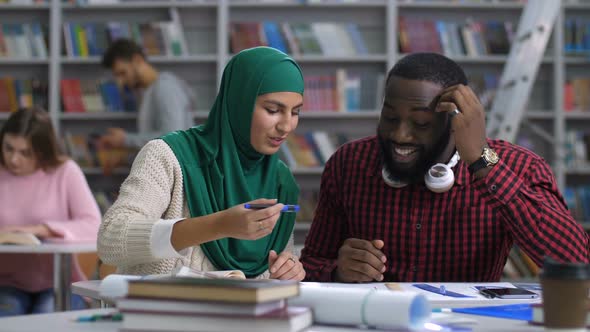 Multi Ethnic Interior Designers Working on Sketch alt