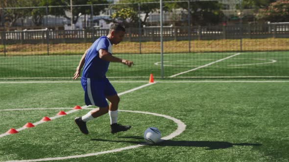 Soccer player training on field alt