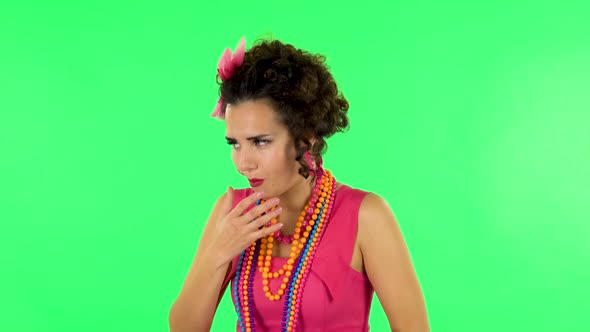 Cute Female Feels Very Bad, Her Stomach Hurts, Feeling Nausea Against Green Screen at Studio. alt