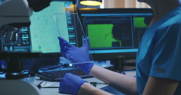 Scientist Using Transparent Display Screen alt