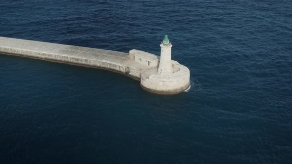 Aerial View Of Pier Lighthouse In Malta Harbour Near Valletta
