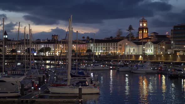 Yahts and Evening Lights of Ponta Delgada. Panning Shot. Sao Miguel Island, Portuguese Archipelago alt