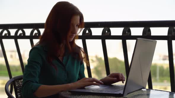  Office Girl Working on Balcony on Laptop