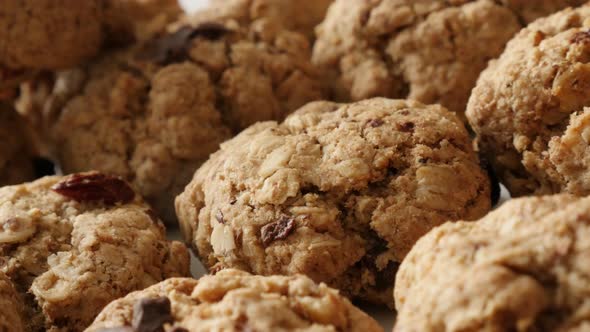 Close-up of chocolate chip cookies pile shallow DOF 4K 2160p 30fps UHD panning footage - Homemade bi alt