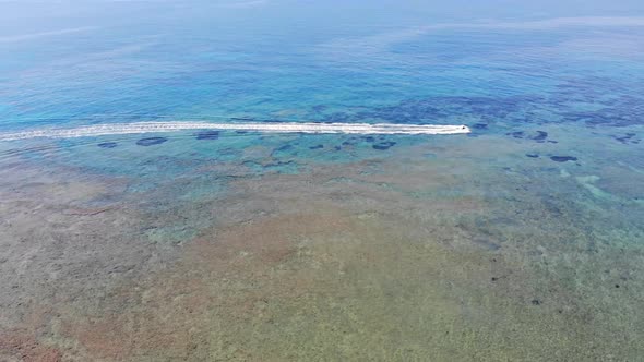 Beautiful aerial footage of the clear ocean sea off the coast of Greece in Corfu alt
