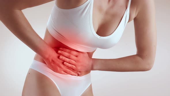 Young Woman Experiencing Stomach Pain