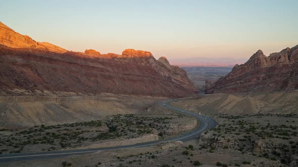 Sunset time lapse viewing traffic on I-70 through the San Rafael Swell alt