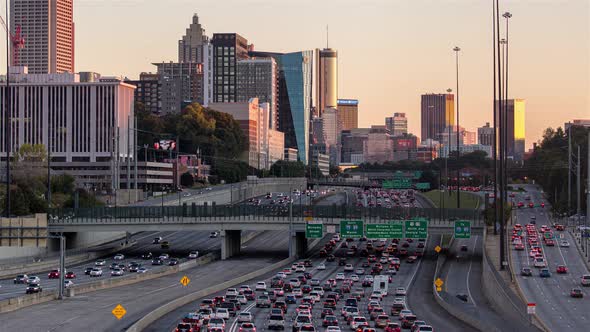 Downtown Atlanta, Georgia Skyline and Freeway Traffic Golden Hour alt