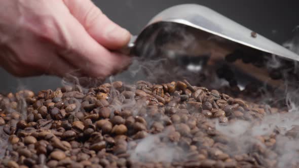 Man Hand Scooping Coffee Grains Using Ladle Close Up alt