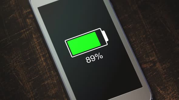 Generic smartphone with lowering battery level symbol. The battery is exhausted.