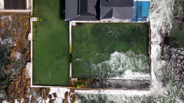 Aerial view of Kalk Bay tidal pools and Brass Bell, Cape Town, South Africa. alt