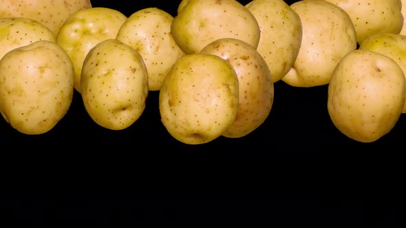 Washed Potatoes In A Jump On Black