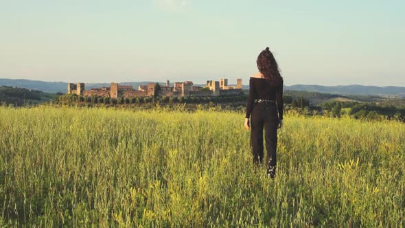 Girl Walking in Chianti landscape in Tuscany, slow motion