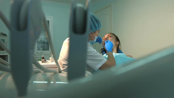 Dentist treats Teeth of Young Girl