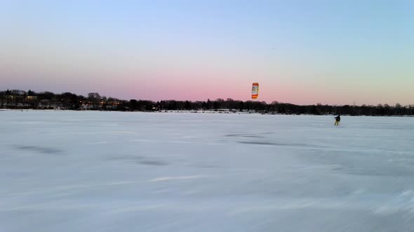 wind surfing over a frozen lake, winter sports in North America alt