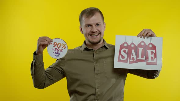 Man Showing Sale Word and Discounts Percentage Advertisement Inscription, Black Friday Concept alt