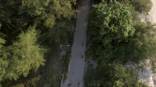Aerial view of a group pedaling bicycles, Gili Trawangan, Indonesia. alt