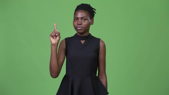 Young Beautiful African Businesswoman Pointing Finger Up