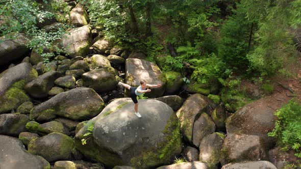 A Girl Practices Yoga in the Jungle alt