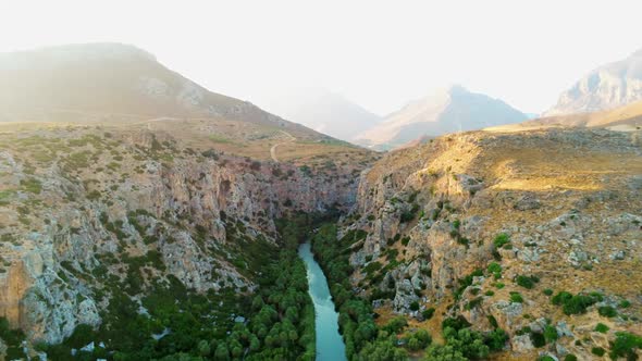 Scenic Aerial View of Canyon with River Palms and Mountains in Crete Greece