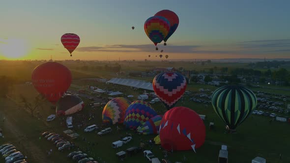 Hot Air Balloons at a Balloon Festival from Filling up to Take Of alt