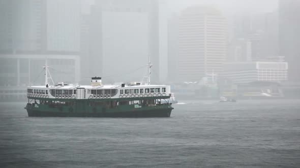 Star Ferry Sailing in the Victoria Harbour with extreme fog in Hong Kong, Slow Motion alt