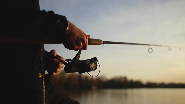 Fishing. Sport fishing. A young man throws spinning.