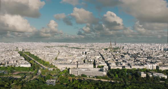 Aerial Drone Distant Sunset View of Tour Eiffel Tower and Seine River Bridge Traffic Cars Driving
