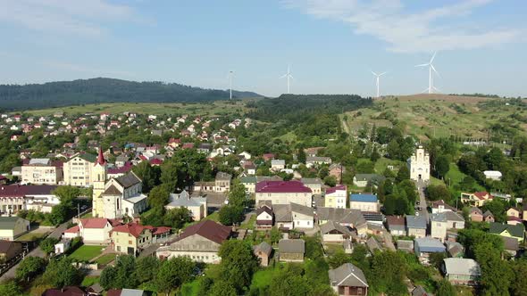Aerial Photography Is a Small Beautiful Town Near the Mountains That Is Powered By Pure Wind Energy alt