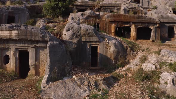 View of the Cave Tombs with Entrance Carved Into the Rocks alt