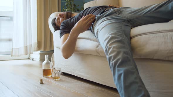 Drunk Man Sleeping on the Couch alt